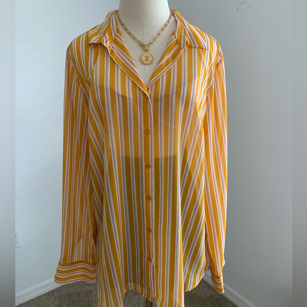 Cool button that blouse. See-through.